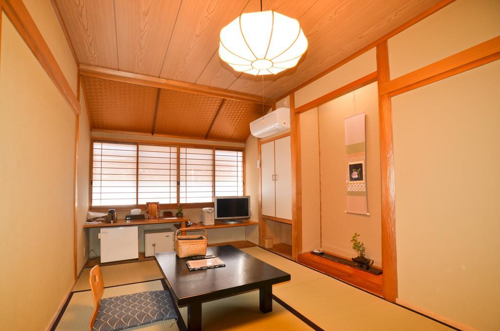 Отель Kunisaki Ундзэн Номер фото